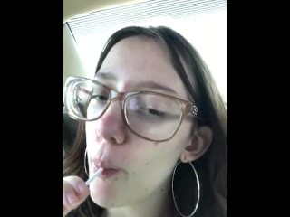Teen girl sucks on lollipop like it’s a dick