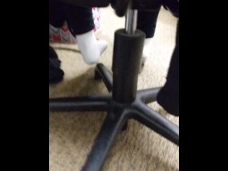 Girl does school work in white nike socks