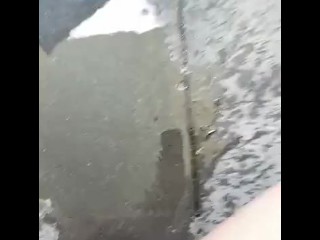 Amateur pissing outside apartment on busy highway