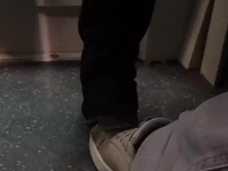 Candid black boots foot trample in bus