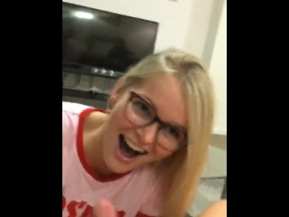 Cute girl in glasses gives handjob and gets a facial
