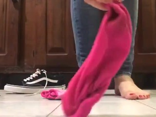 Taking off socks and shoe girl show feets