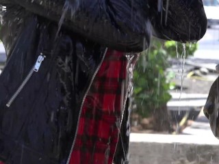Hot chick in a leather jacket plays in a fountain.