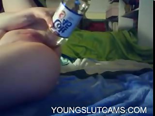 Amateur teen shoves bottle up her pussy