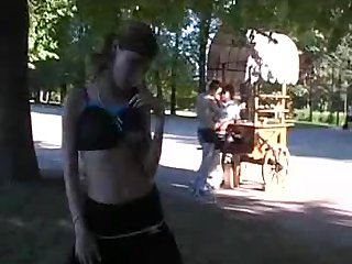 pretty girl flashing body in public park