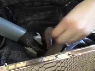 Vacuuming dirty handbag