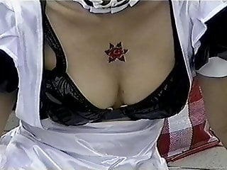 Japanese cosplay girl shows off her cleavage (not so big)