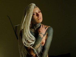 Blonde tattooed witch showing herself