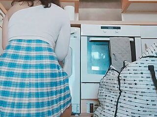 Asian chick showing her Asian pussy while doing her laundry