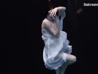 Redhead beauty in the white dress