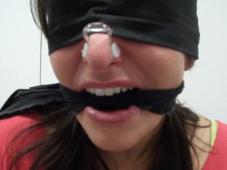 BLINDFOLDED, GAGGED AND WITH NOSE PLUGGED WITH A CLIP