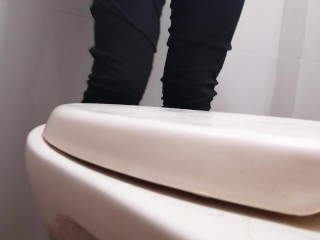 I film my friend peeing standing in my bathroom.