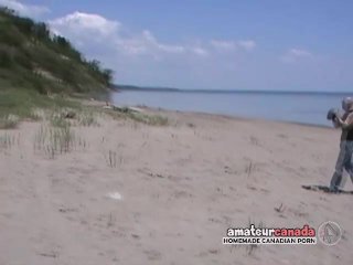 Bikini babe learning football then masturbates on beach