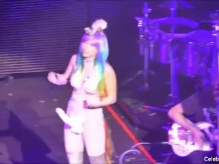 MILEY CYRUS SHOWS OFF HER SLIM BODY WITH HUGE DILDO ON A STAGE
